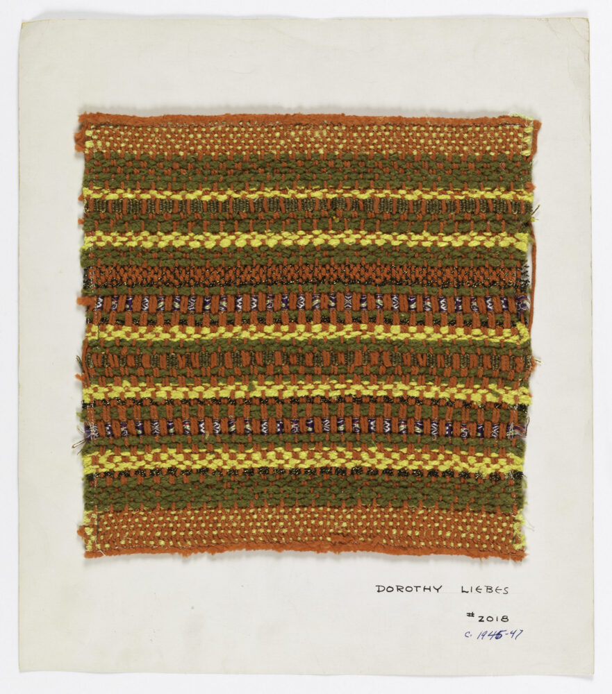 woven textile sample of orange and green threads