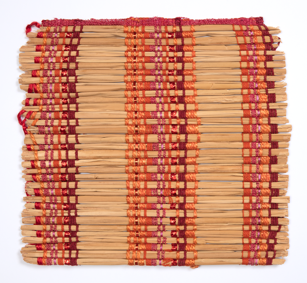 sample of a window blind with bamboo rods and red thread