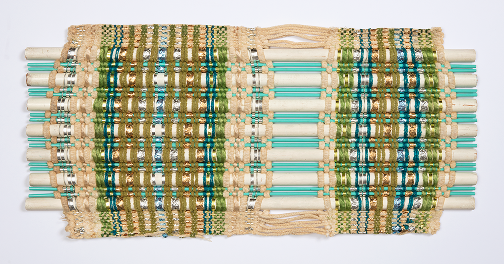 window blind sample of white and aqua rods woven together with blue, green, and cream threads