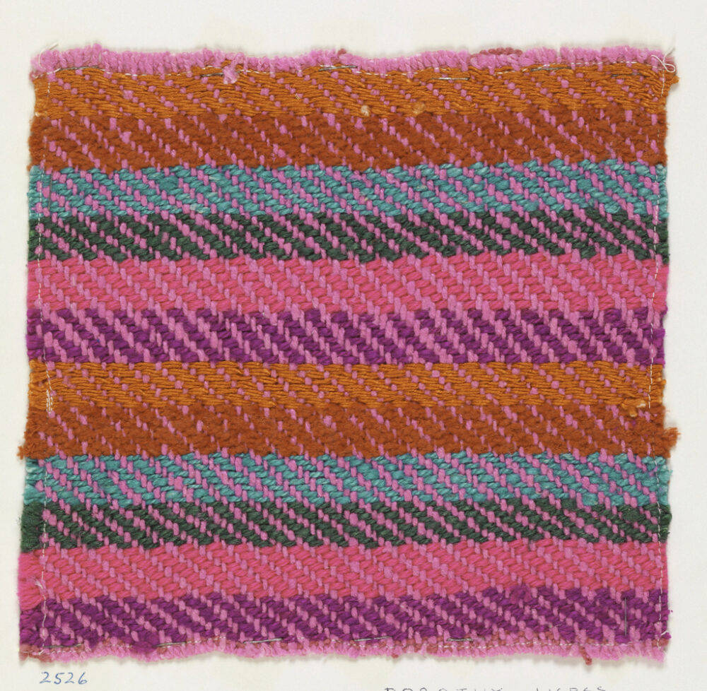 woven textile sample of pink, orange, magenta and blue threads