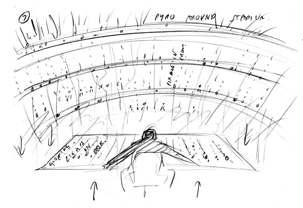 Expressive drawing of a person, seen from behind, sitting in a chair with arms extended across a rectangular surface. The person is facing a stadium-like form of rows and tiers of a crowd.