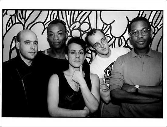 Grayscale photograph of Peter Gordon, Bill T. Jones, Arnie Zane, Keith Haring, and Willi Smith