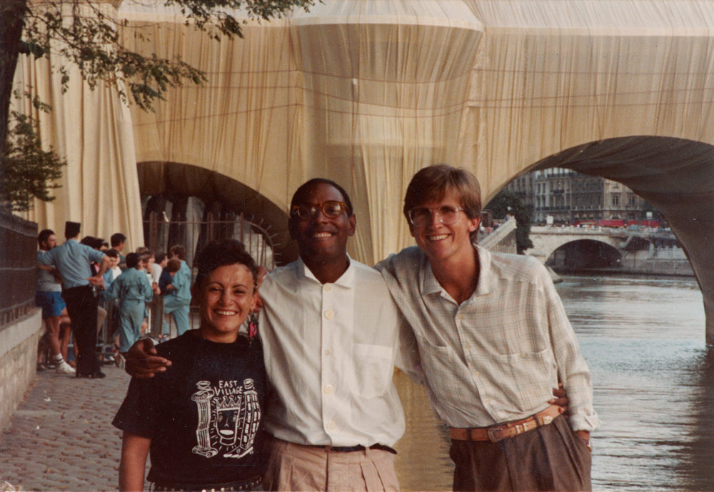 Photograph of Laurie Mallet, Willi Smith, and Mark Bozek in front of The Pont Neuf Wrapped