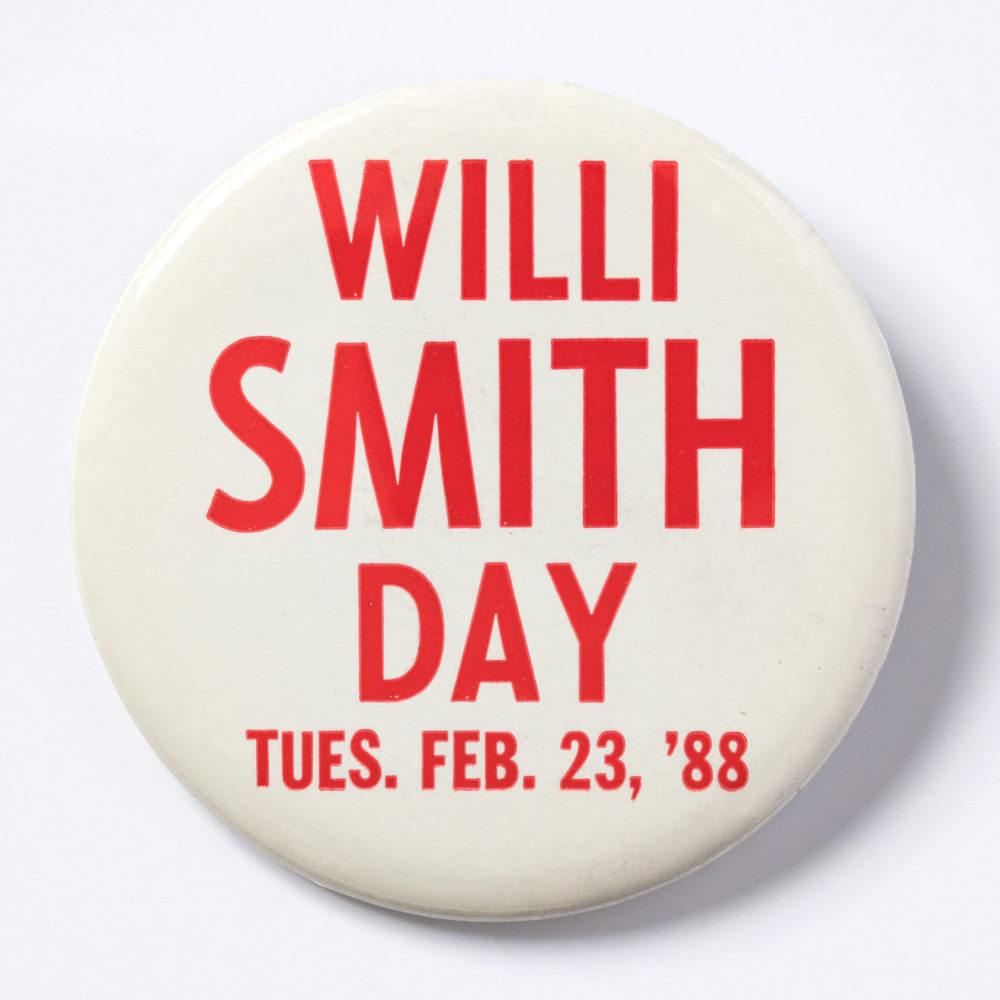 White round pin with red text stating, "Willi Smith Day, Tues. Feb. 23, '88"