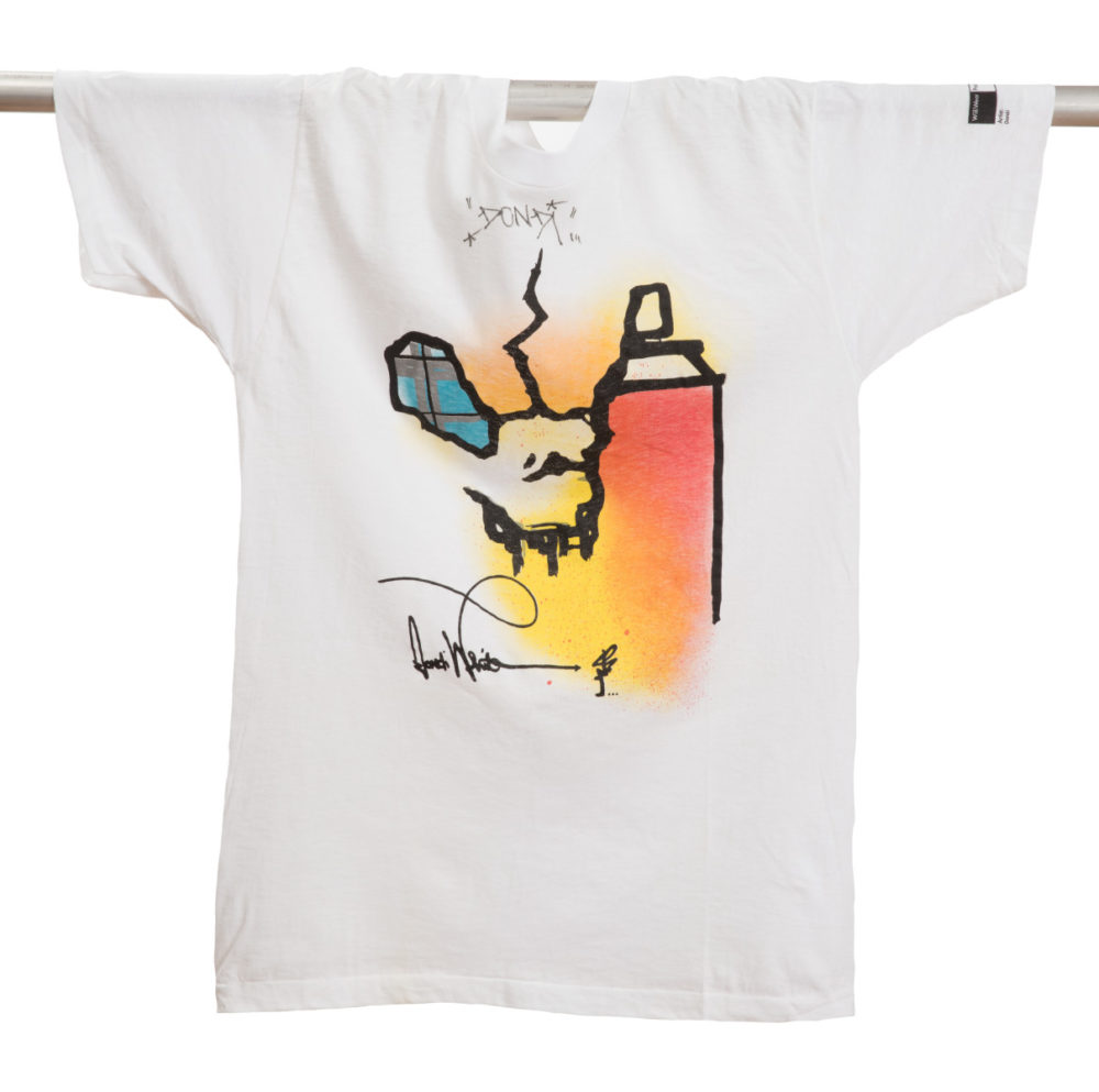White cotton T-Shirt featuring a spray-painted image of an orange and yellow spray-paint can